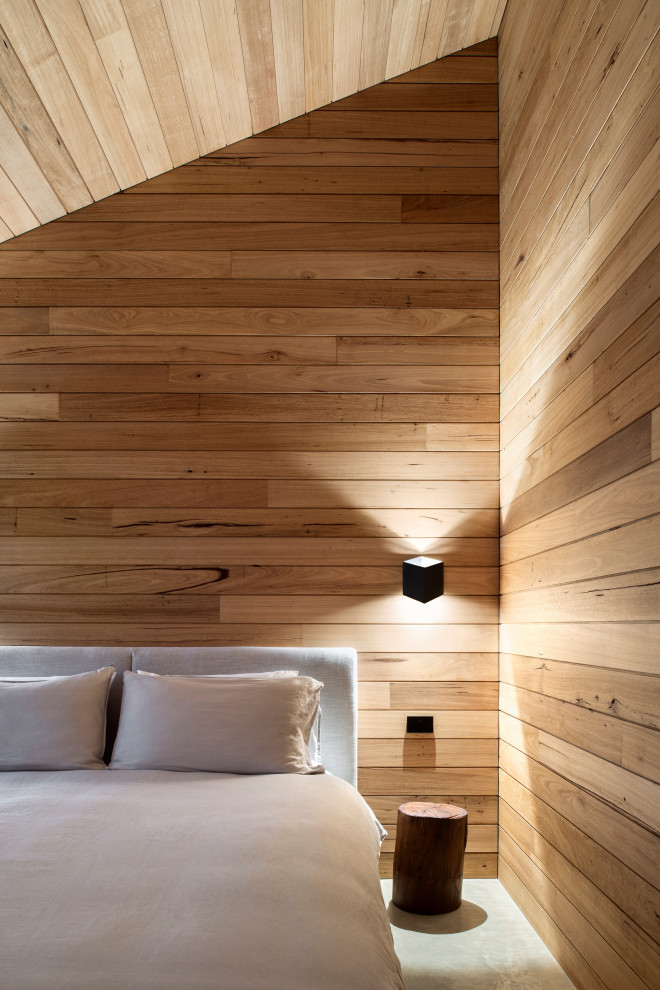 Inspiration for a contemporary concrete floor, gray floor, vaulted ceiling, wood ceiling and wood wall bedroom remodel in Other with brown walls