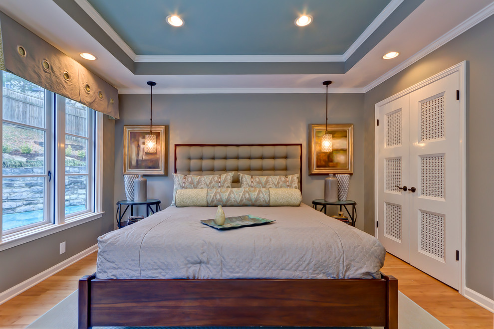 Example of a transitional bedroom design in Nashville with gray walls