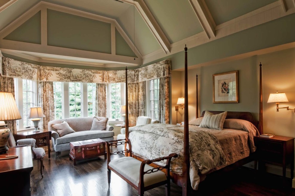 Photo of a large traditional master bedroom in Nashville with green walls, dark hardwood flooring and brown floors.