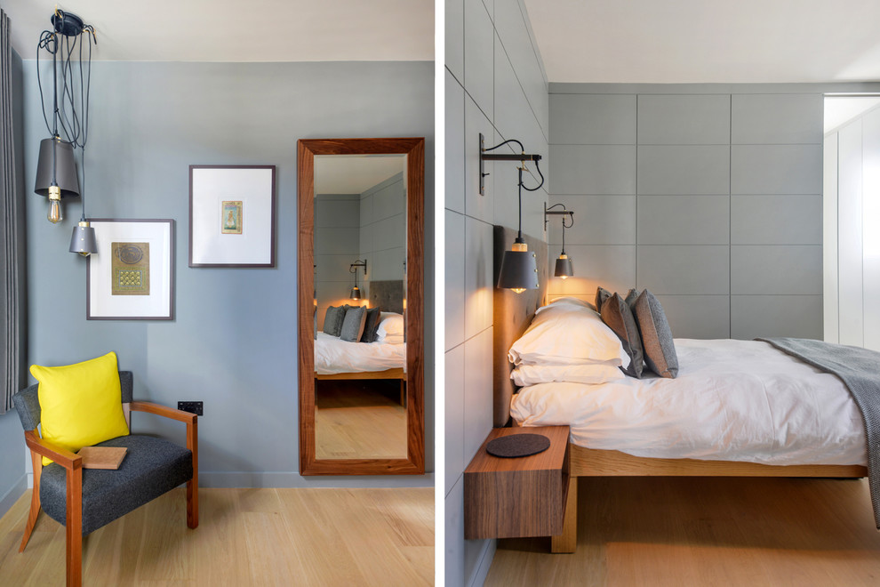 Inspiration for a small contemporary guest bedroom in London with grey walls, light hardwood flooring and brown floors.