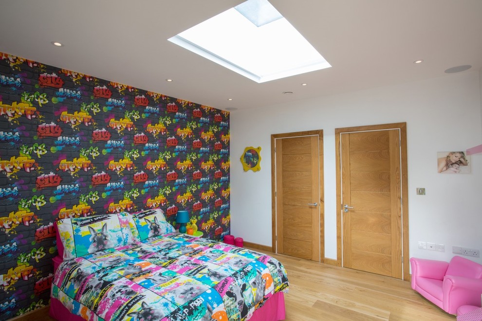 Example of a mountain style light wood floor bedroom design in Oxfordshire with multicolored walls