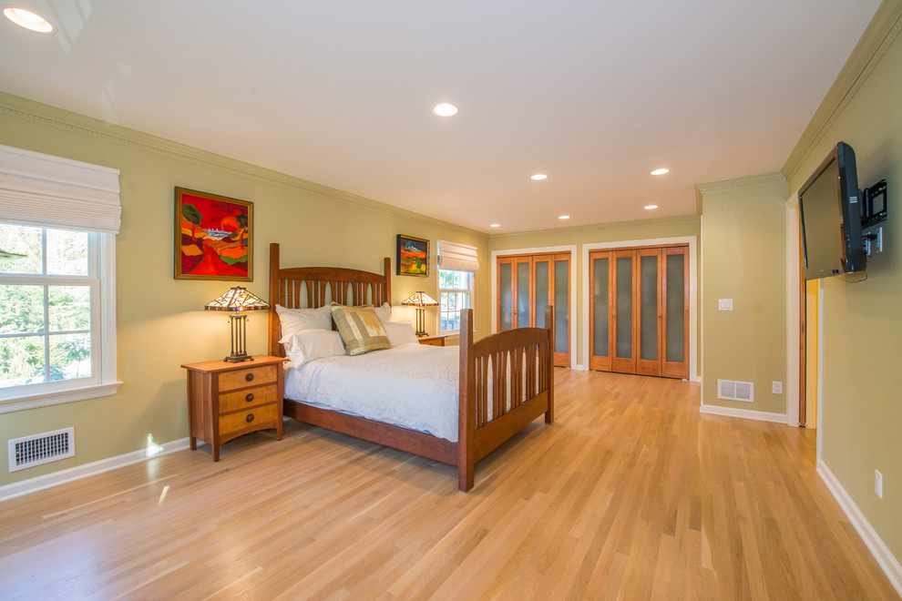 Bedroom - large craftsman master light wood floor bedroom idea in New York with green walls and no fireplace
