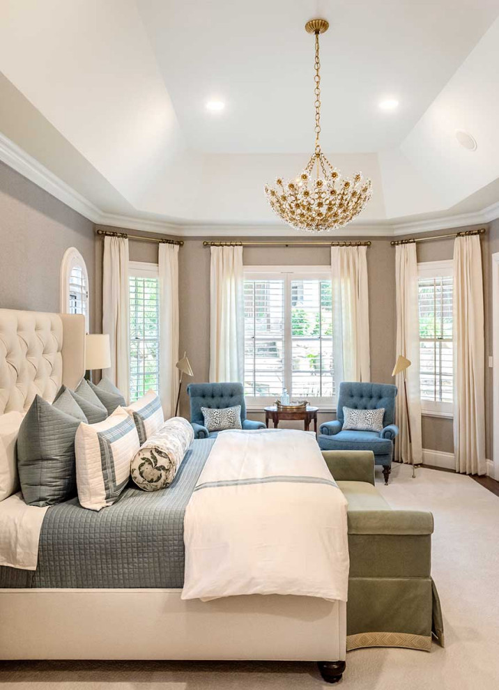 This is an example of a large classic master bedroom in Austin with grey walls, carpet, white floors and wallpapered walls.