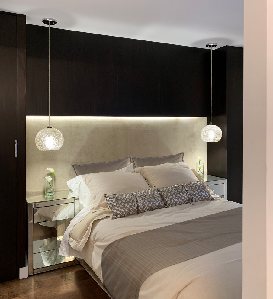 Small modern mezzanine bedroom in New York with white walls, dark hardwood flooring and brown floors.