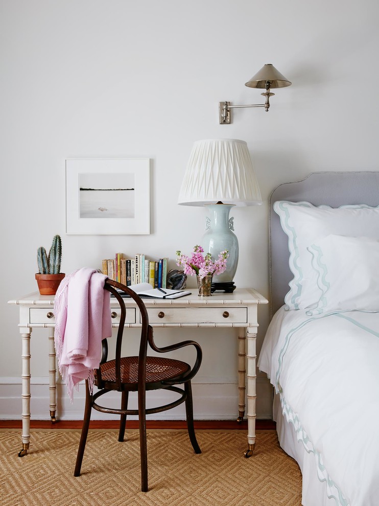 Classic bedroom in New York with white walls and dark hardwood flooring.