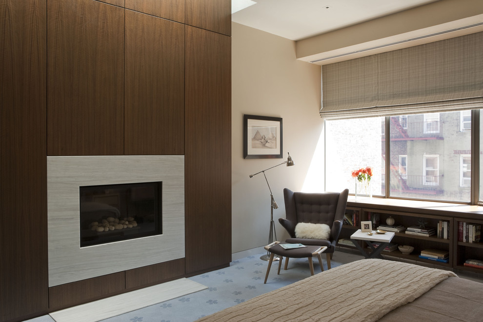 Design ideas for a contemporary bedroom in New York with a standard fireplace.