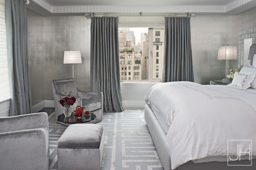 Example of a large transitional master carpeted bedroom design in Miami with gray walls