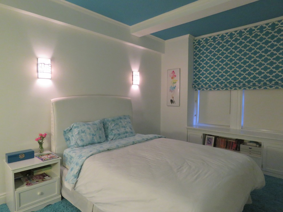 Inspiration for a mid-sized transitional carpeted and beige floor bedroom remodel in New York with blue walls and no fireplace