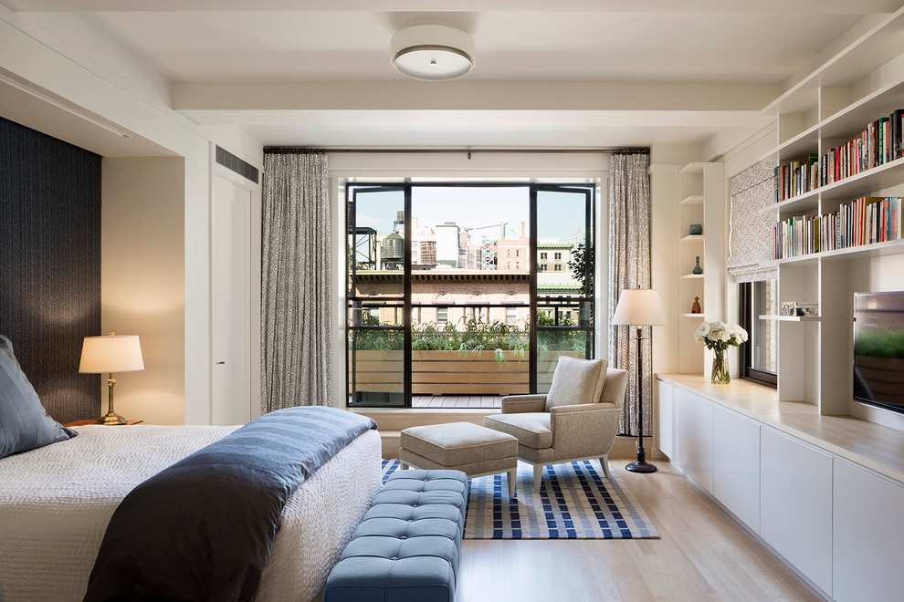 Mid-sized trendy master light wood floor bedroom photo in New York with white walls and no fireplace