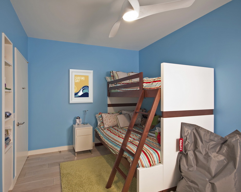 Example of a minimalist bedroom design in New York with blue walls