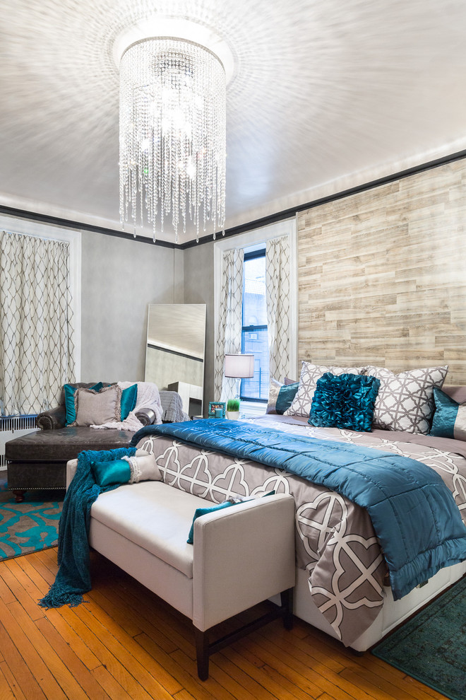 Large minimalist master light wood floor bedroom photo in New York with gray walls