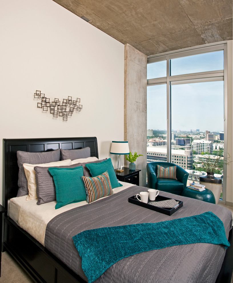 Inspiration for a contemporary grey and teal bedroom in Dallas with beige walls and carpet.
