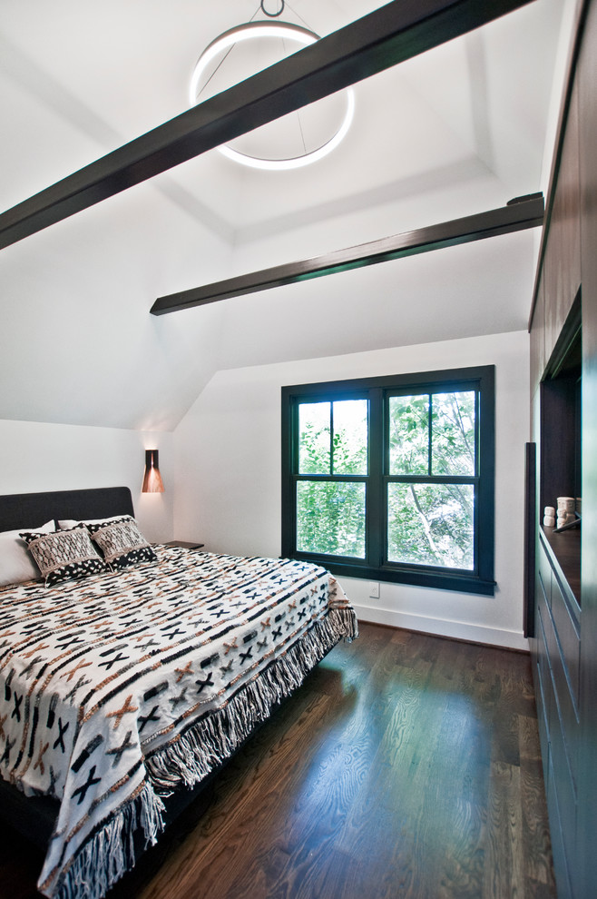 Example of a small trendy master dark wood floor and brown floor bedroom design in Nashville with white walls