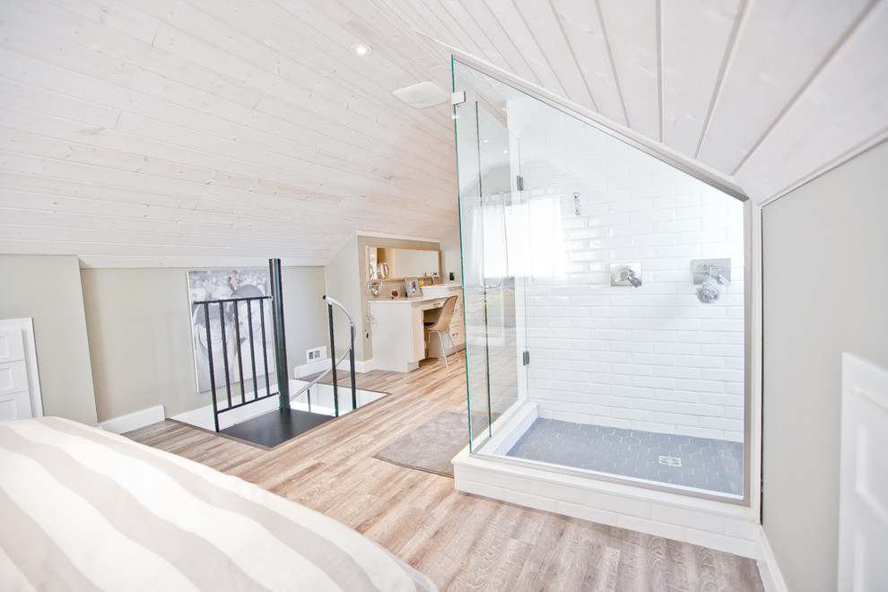 Bedroom - large contemporary loft-style light wood floor bedroom idea in Toronto with gray walls