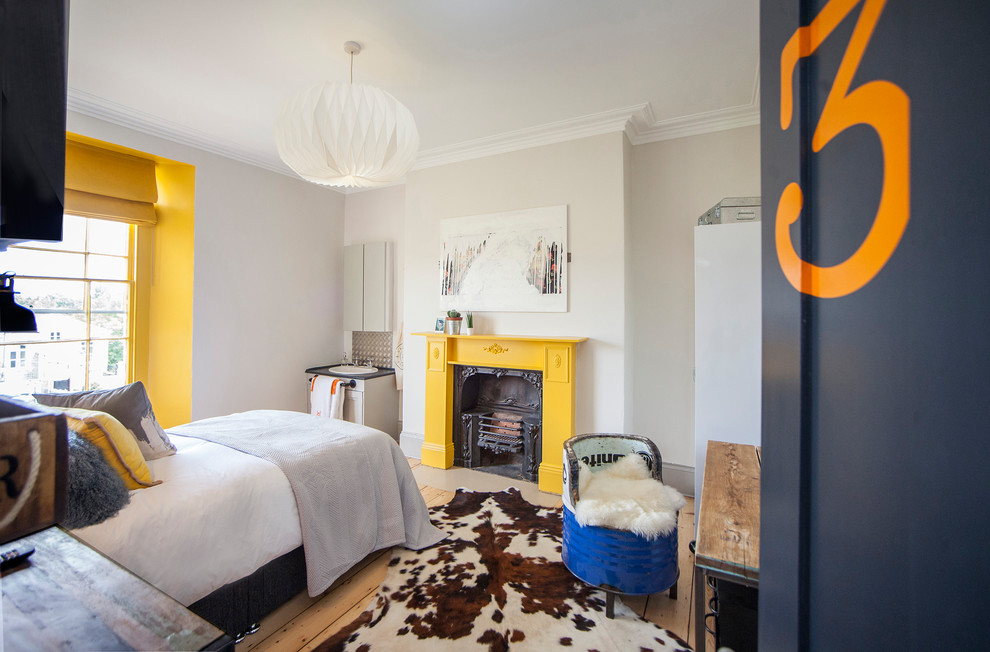 Contemporary grey and yellow bedroom in Other.
