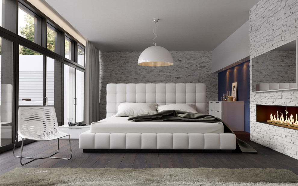 Пример оригинального дизайна: хозяйская спальня среднего размера в стиле лофт с серыми стенами, светлым паркетным полом, угловым камином, фасадом камина из камня и серым полом