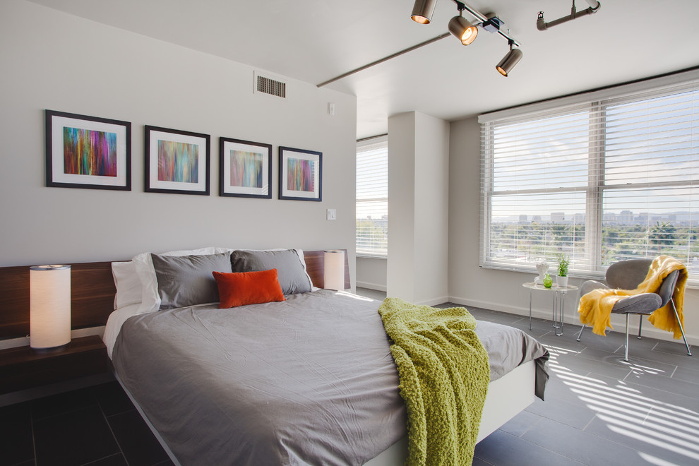 Photo of a small contemporary master bedroom in Phoenix with grey walls, no fireplace, porcelain flooring and grey floors.