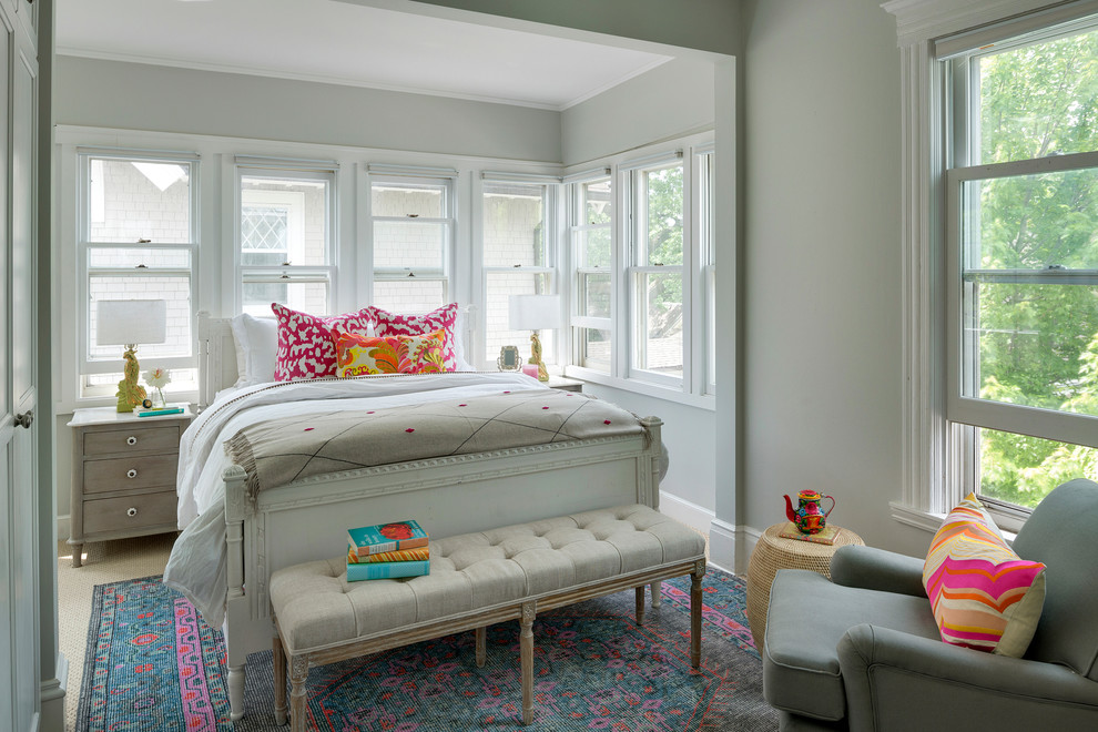 This is an example of a traditional master bedroom in Minneapolis with grey walls and carpet.