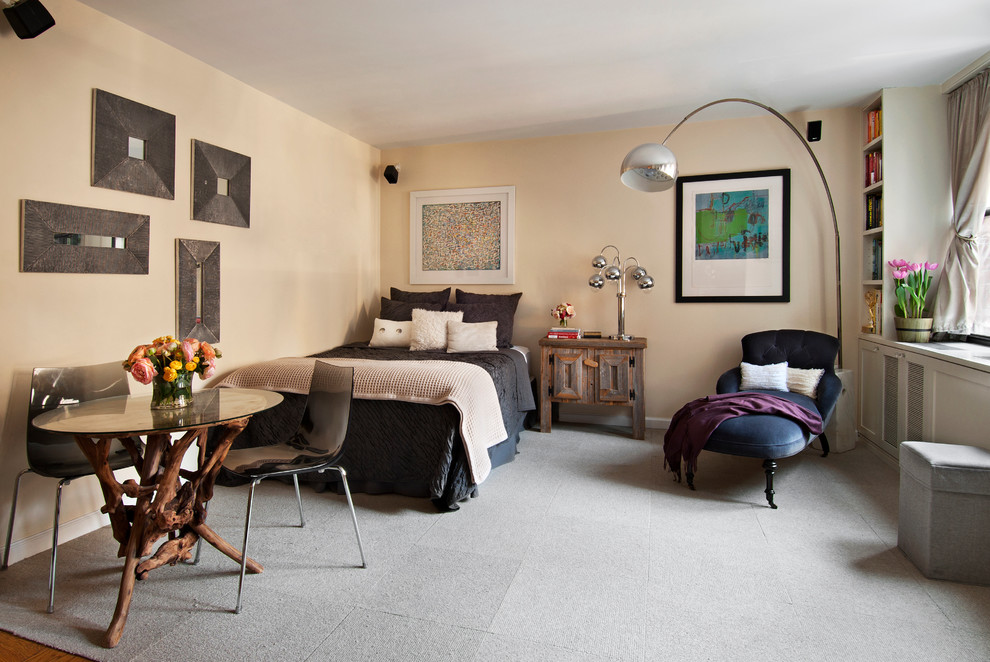 Trendy carpeted bedroom photo in New York with beige walls and no fireplace