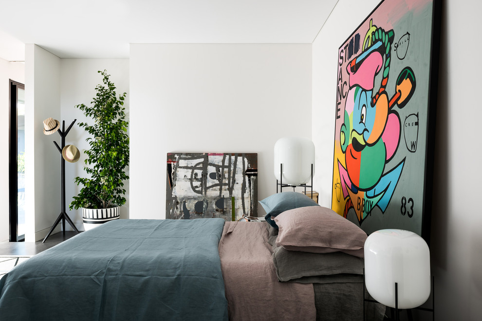 This is an example of a bohemian master bedroom in Perth with white walls, concrete flooring and grey floors.