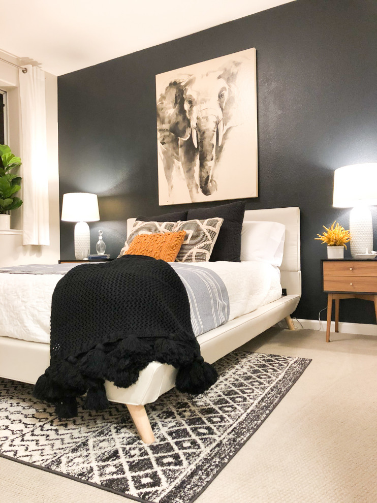 Ispirazione per una camera da letto minimalista con pareti nere e moquette