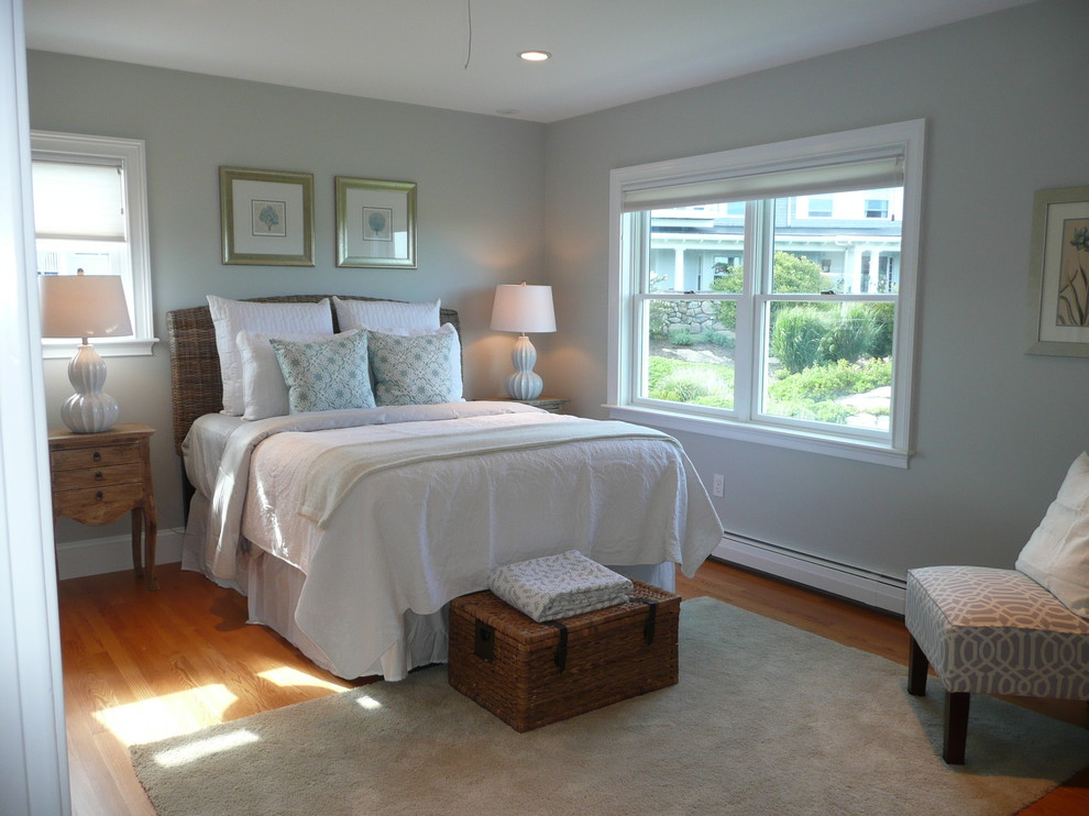 Bedroom - large coastal guest medium tone wood floor bedroom idea in Boston with blue walls and no fireplace