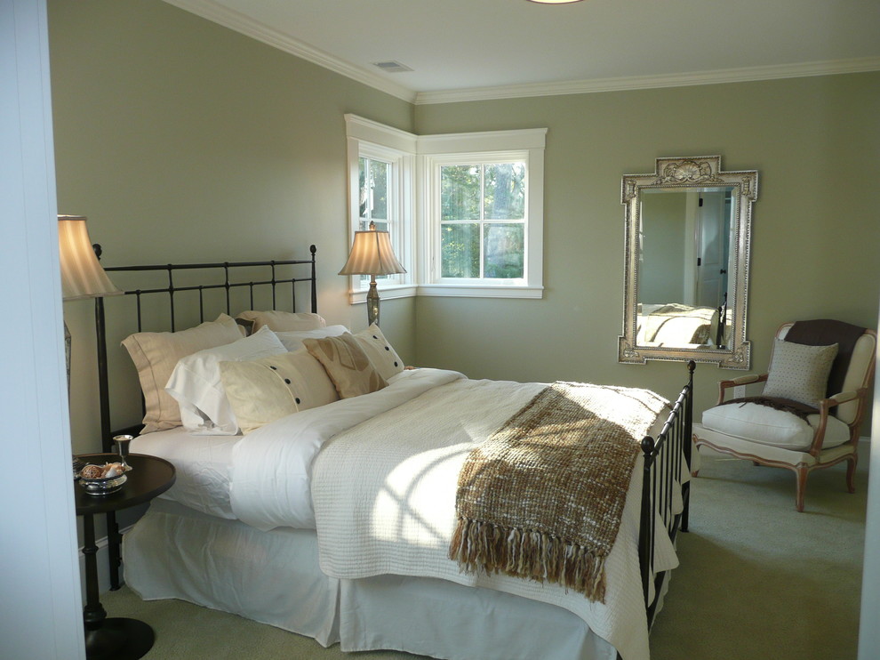 Example of a mid-sized transitional master carpeted bedroom design in Boston with green walls and no fireplace