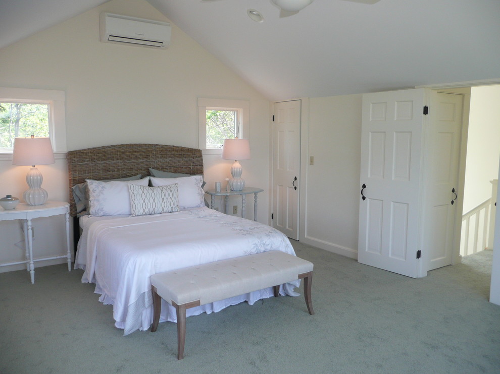 Example of a large beach style master bedroom design in Boston