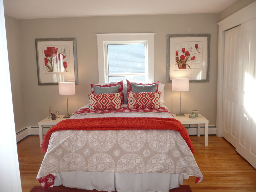 Mid-sized transitional master light wood floor bedroom photo in Boston with beige walls and no fireplace