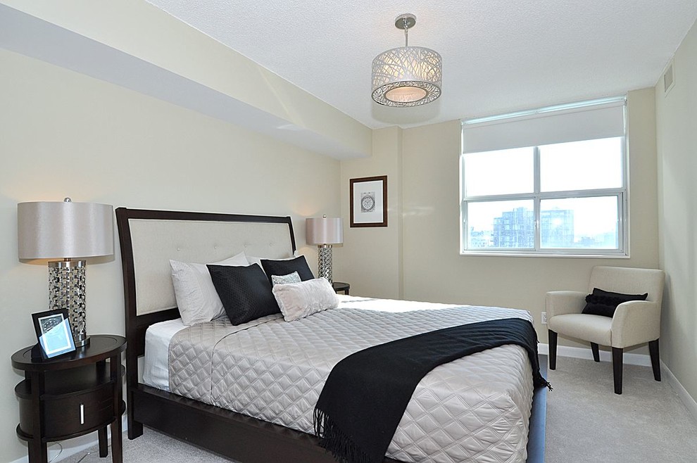 Example of a trendy master carpeted bedroom design in Toronto with no fireplace