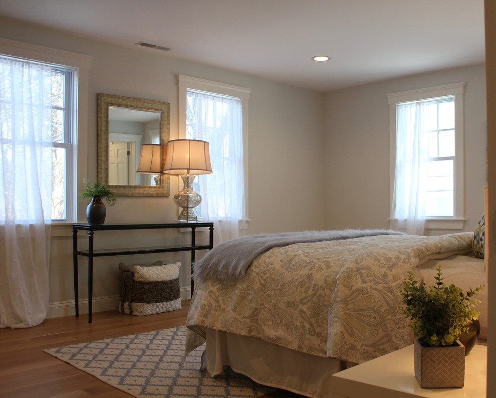 Bedroom - mid-sized transitional master light wood floor and beige floor bedroom idea in Boston with blue walls and no fireplace