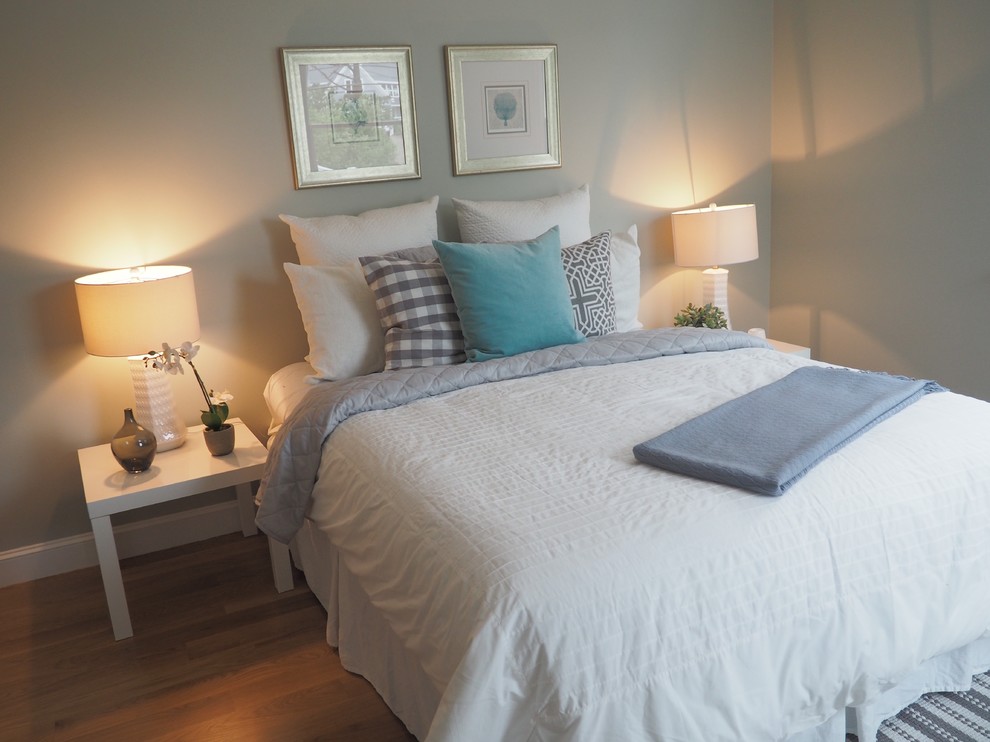 Mid-sized beach style medium tone wood floor bedroom photo in Boston with gray walls