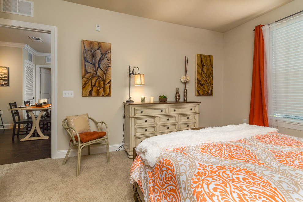 Photo of a medium sized farmhouse master bedroom in Tampa with beige walls and carpet.