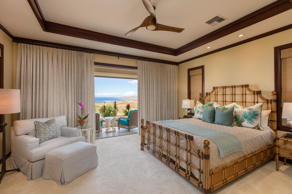 Example of a large master carpeted and beige floor bedroom design in Hawaii with beige walls and no fireplace
