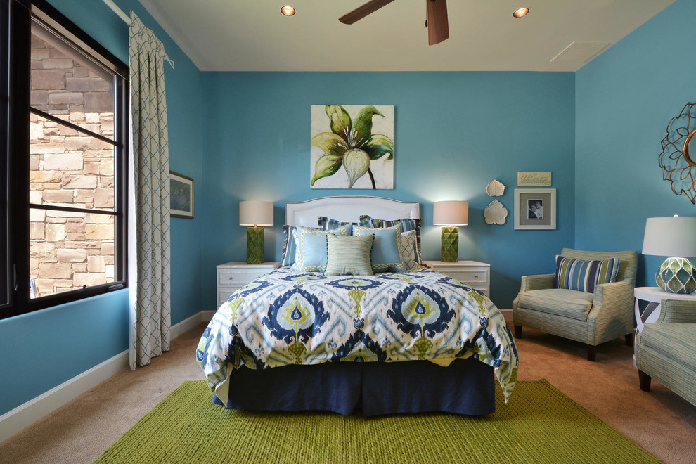 Inspiration for a mid-sized mediterranean guest carpeted bedroom remodel in Austin with blue walls