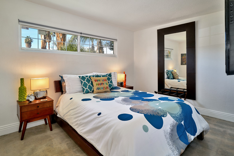 Small 1950s guest concrete floor and beige floor bedroom photo in Other with white walls