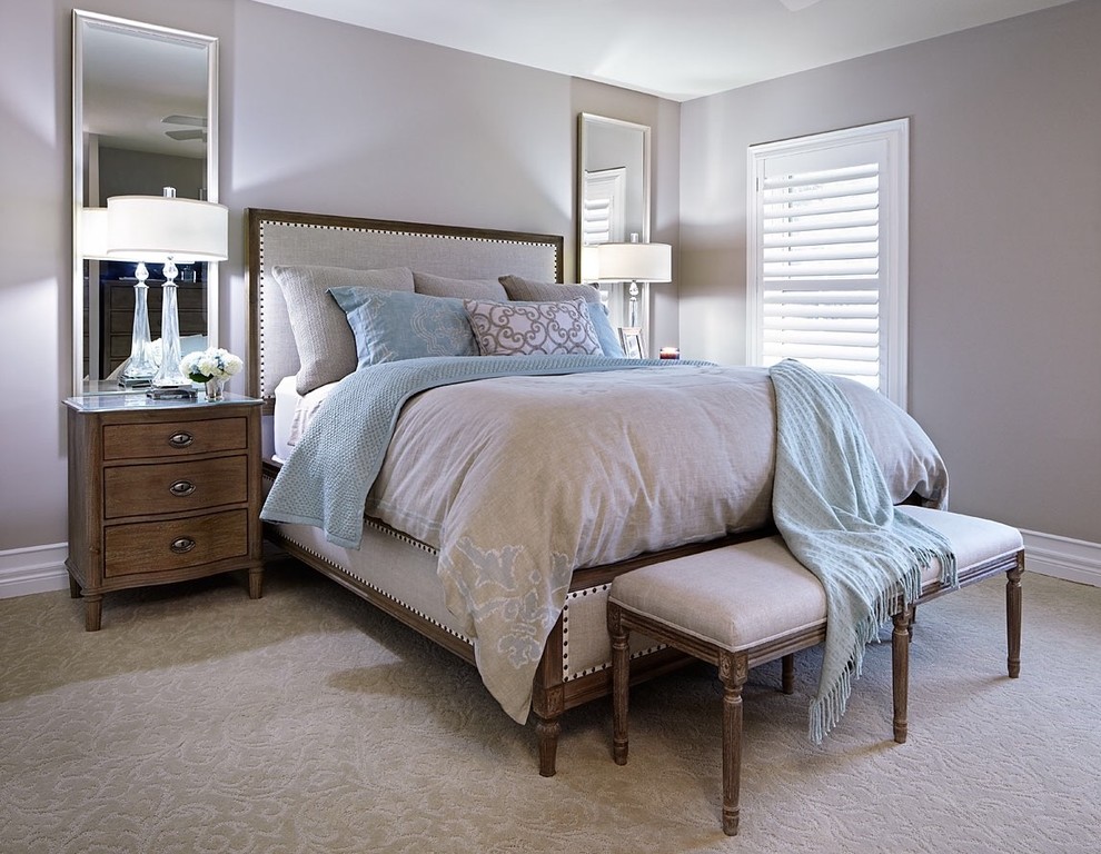This is an example of a large classic guest bedroom in Toronto with grey walls and carpet.