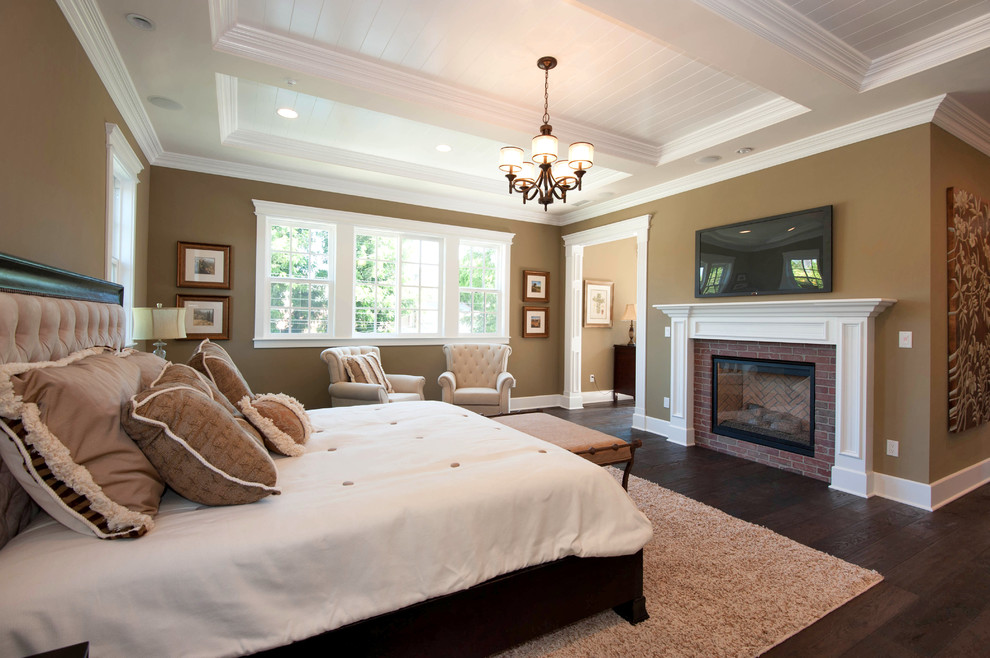Elegant dark wood floor bedroom photo in Los Angeles with brown walls, a standard fireplace and a brick fireplace