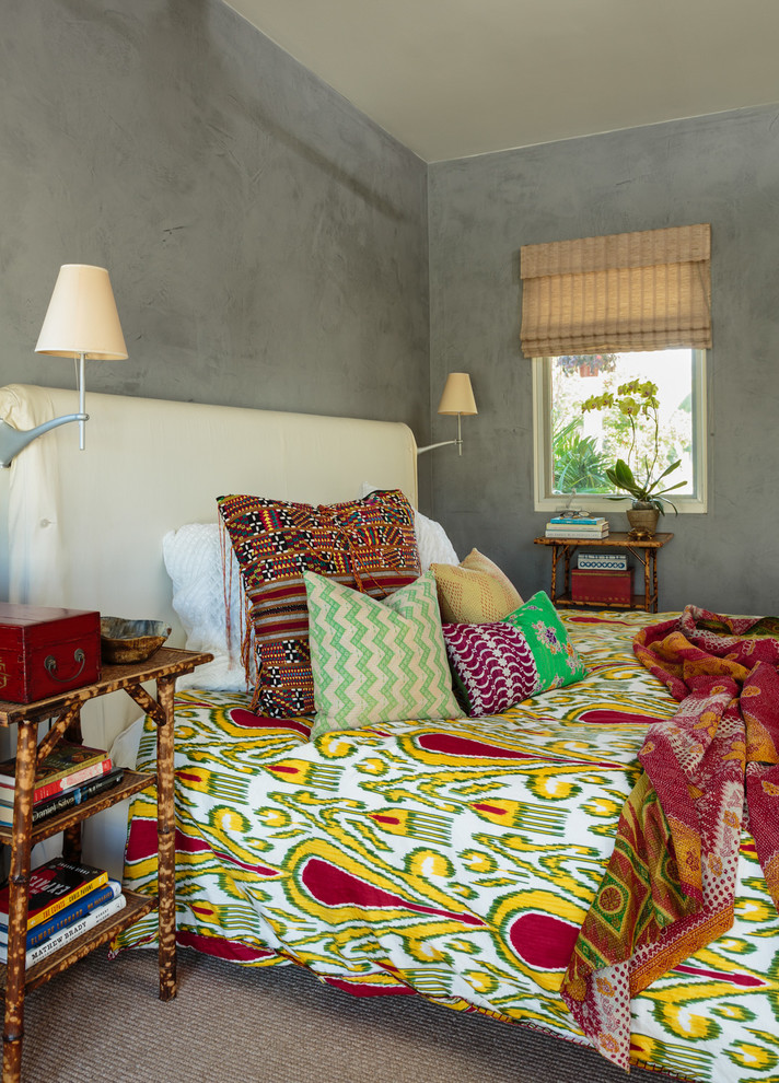 Photo of a small bohemian bedroom in Los Angeles with grey walls.