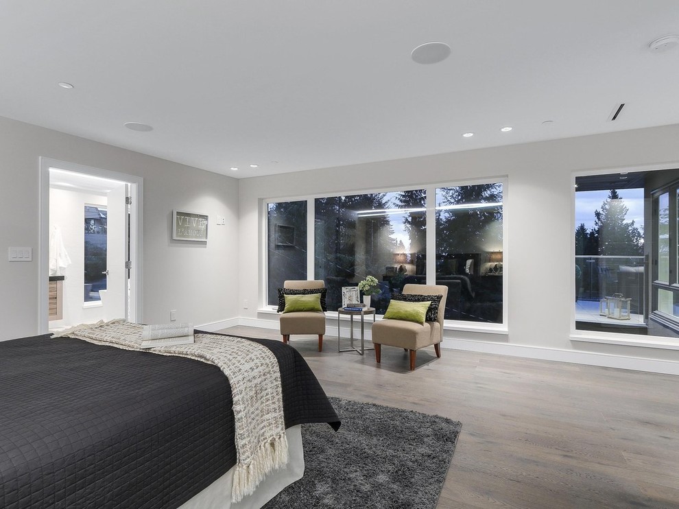Large trendy master light wood floor and beige floor bedroom photo in Vancouver with gray walls and no fireplace