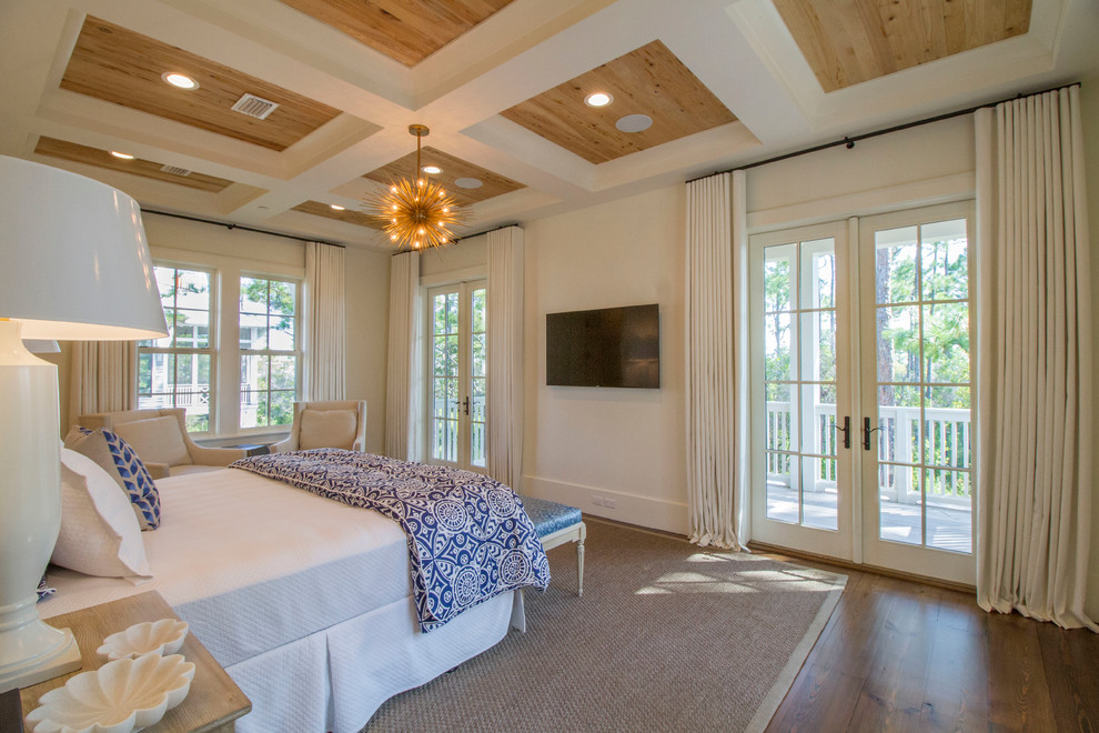 This is an example of a nautical bedroom in Miami with white walls, dark hardwood flooring and no fireplace.