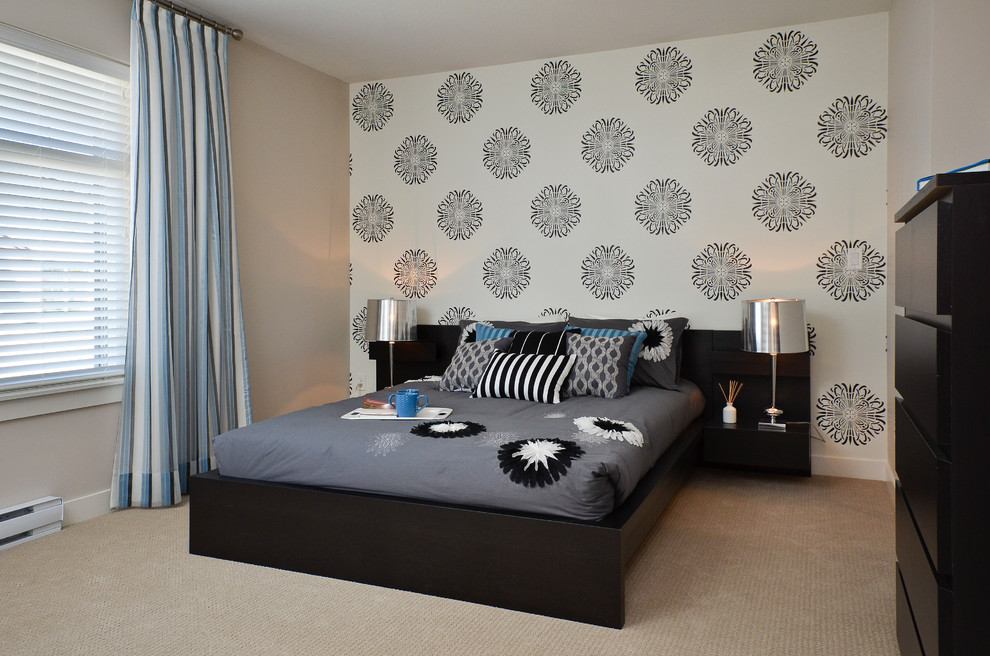 Contemporary bedroom in Vancouver with beige walls, carpet and feature lighting.