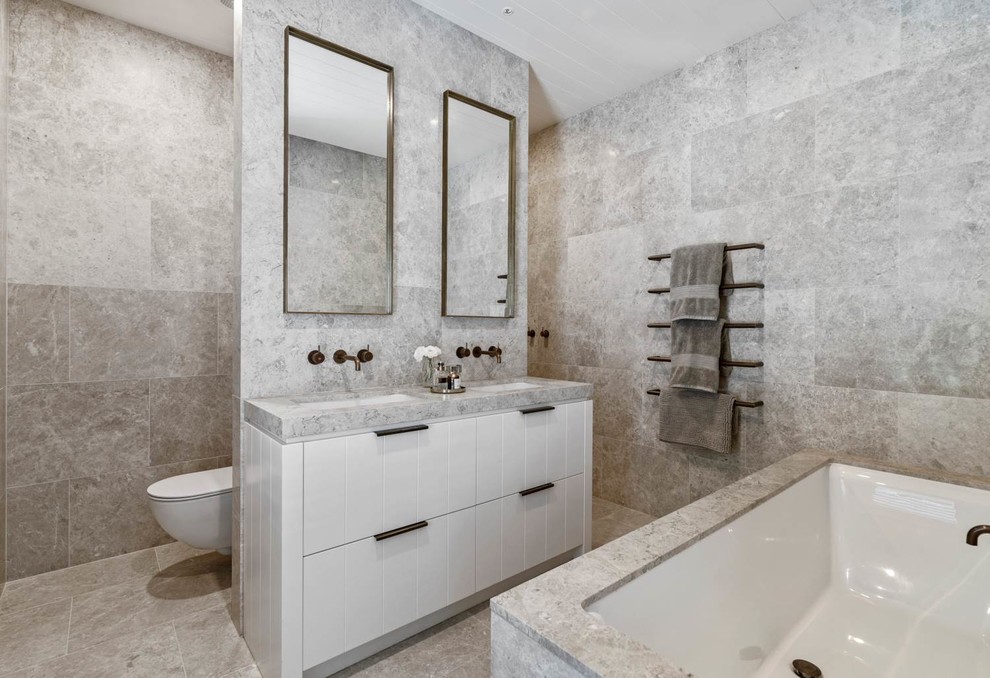 Large cottage porcelain tile and gray floor bathroom photo in Auckland with beige walls