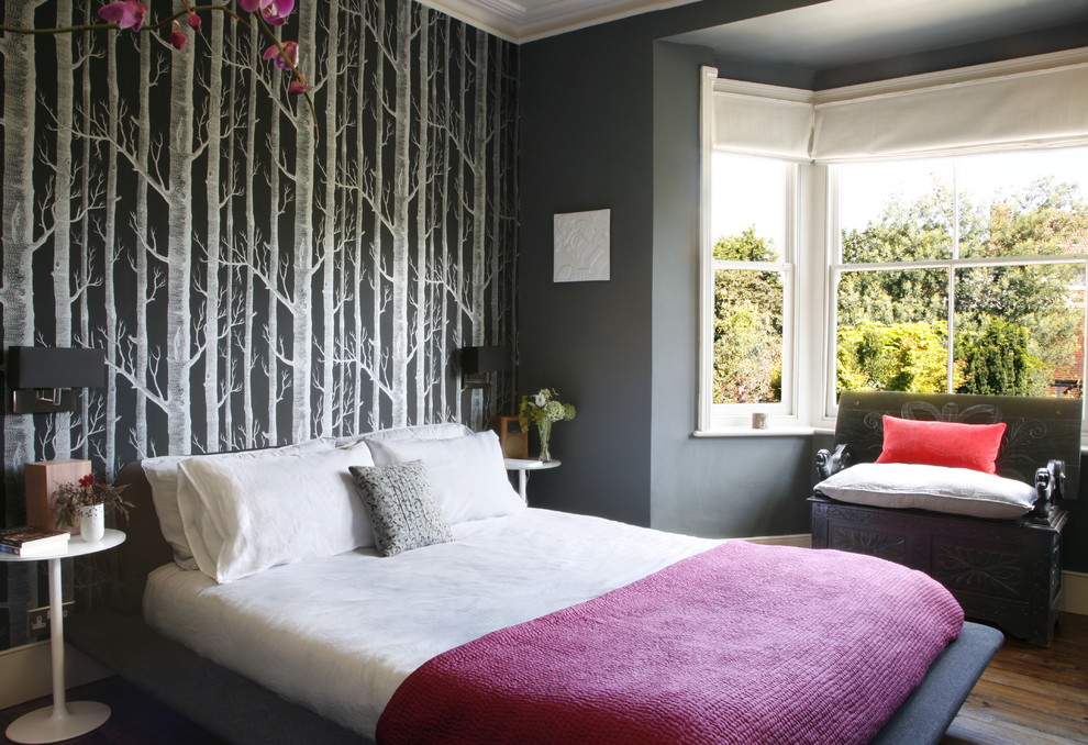This is an example of a bohemian grey and pink bedroom in London.