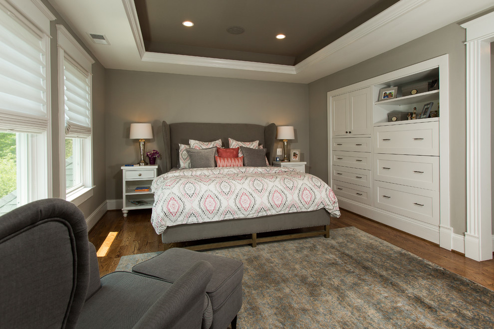 Large transitional master medium tone wood floor and brown floor bedroom photo in DC Metro with gray walls and no fireplace