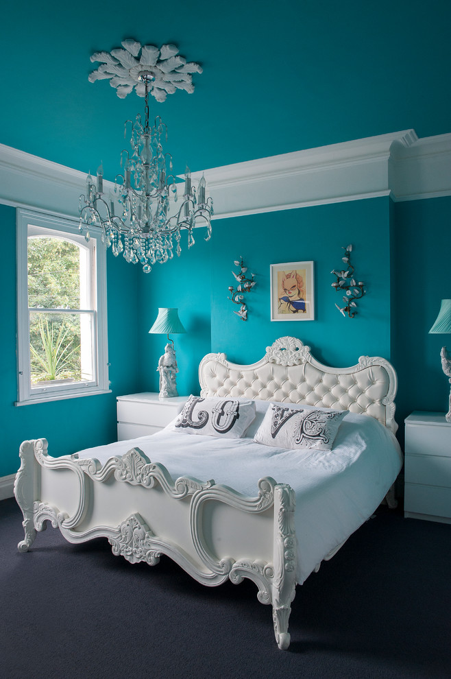 Inspiration for an eclectic master carpeted bedroom remodel in Gloucestershire with blue walls