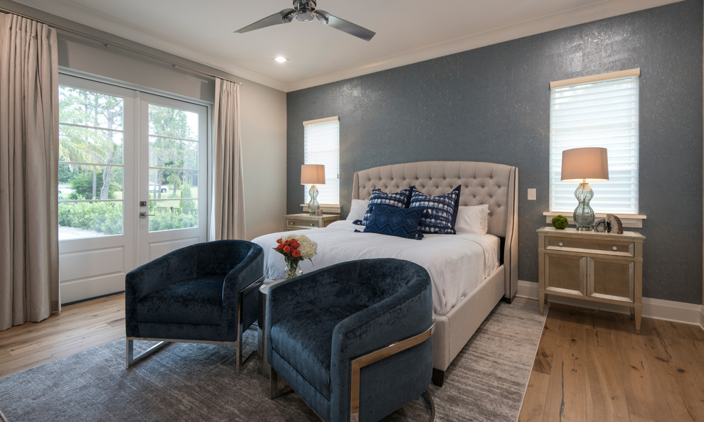 Classic grey and brown bedroom in Orlando with blue walls, medium hardwood flooring and brown floors.