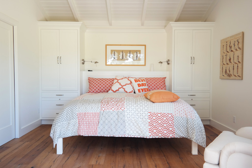 Bedroom - small country guest medium tone wood floor bedroom idea in San Francisco with white walls