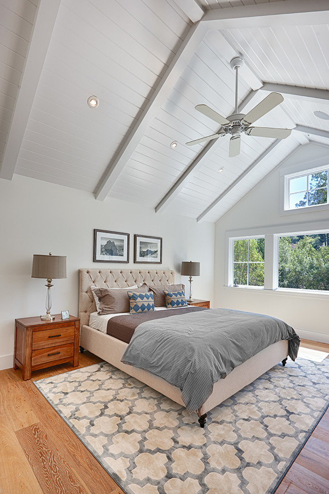 Inspiration for a farmhouse master light wood floor bedroom remodel in San Francisco with white walls