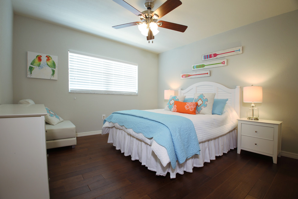 Bedroom - small coastal guest dark wood floor bedroom idea in Tampa with gray walls and no fireplace